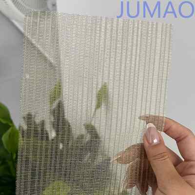 I pannelli di vetro laminati a maglia per mobili decorativi introducono un caldo splendore negli interni